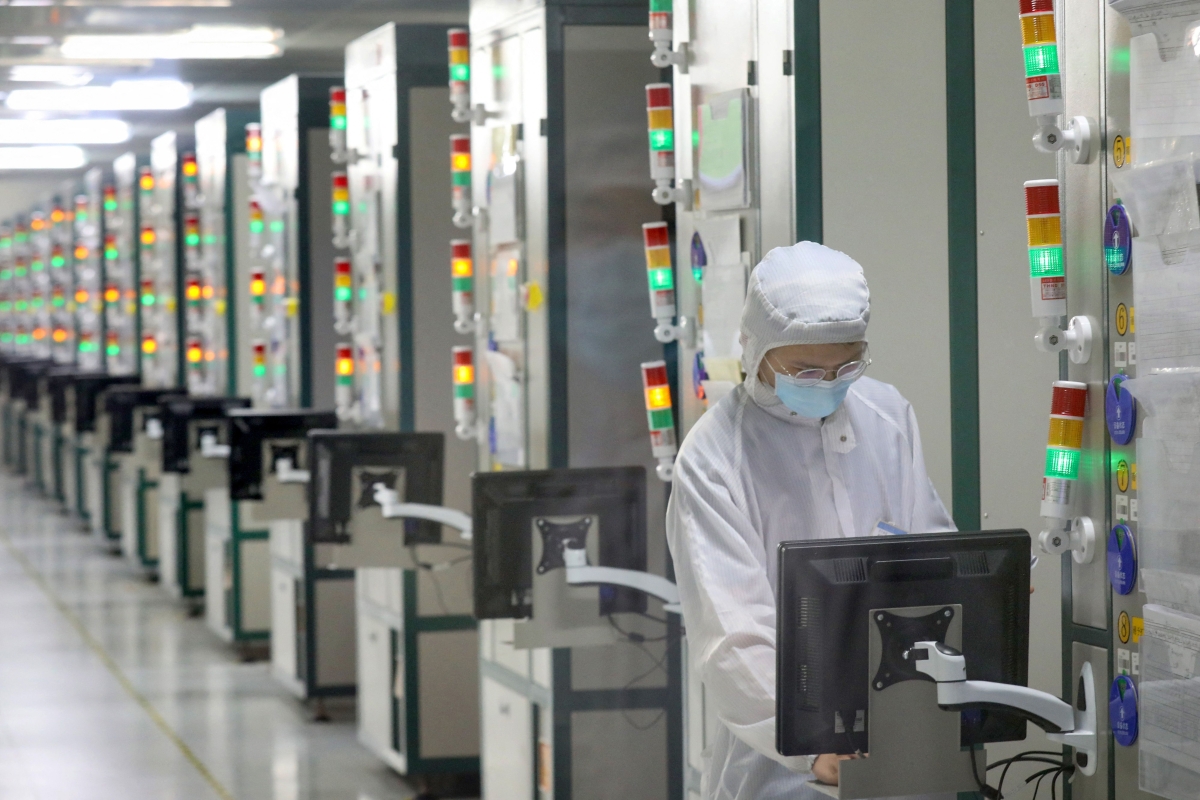 An employee works at a factory of Jiejie Semiconductor Company in Nantong