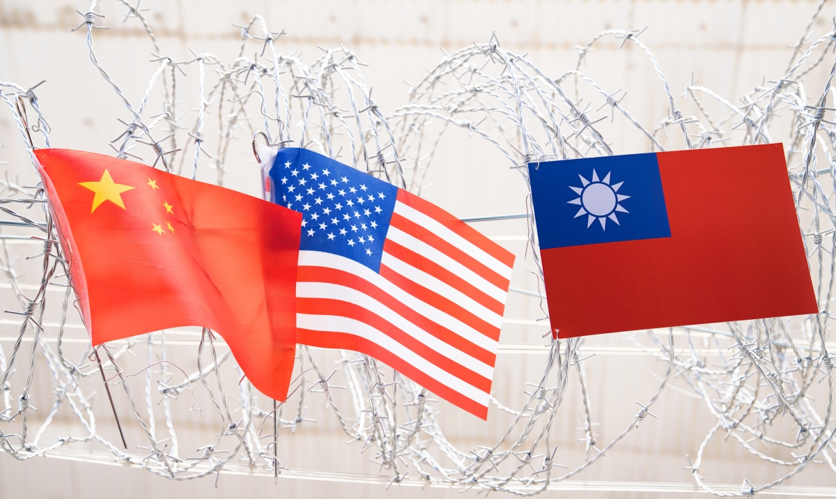 Flag Republic of China, USA - American and Flag of the Republic of China, (Taiwan) Waving In The Wind on barbed wire
