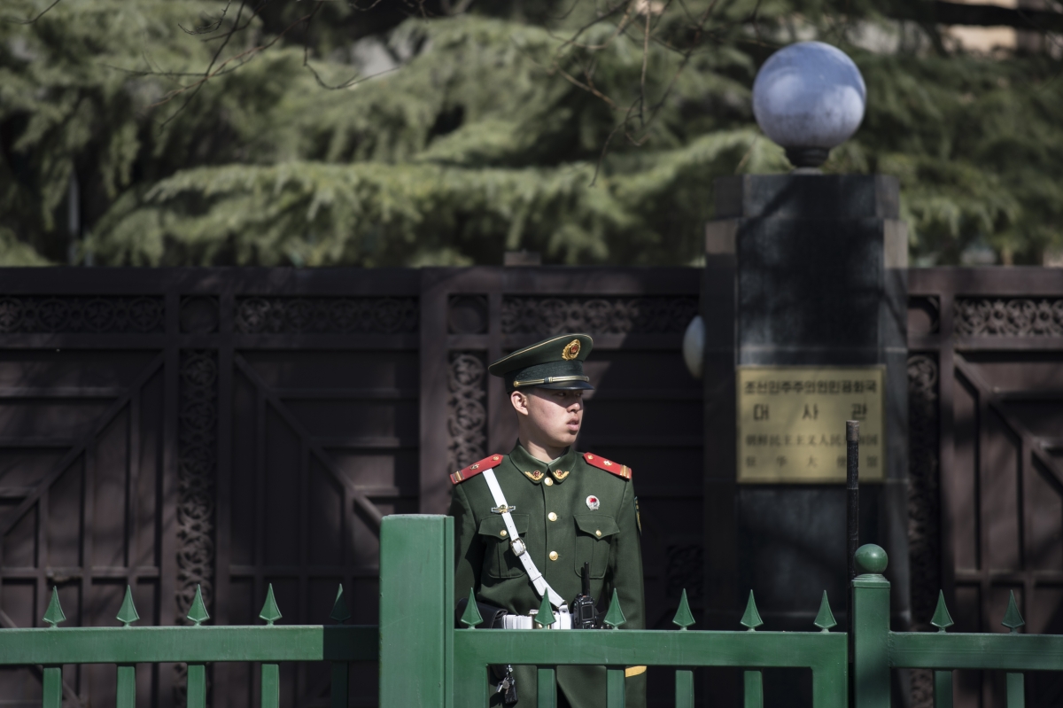A Chinese paramilitary police officer stands at the entrance of the North Korean embassy in Beijing on March 8, 2017. China's foreign minister called for North Korea to suspend its nuclear and missile activities, and for the US and South Korea to halt military exercises to cool what he called a looming security "crisis."