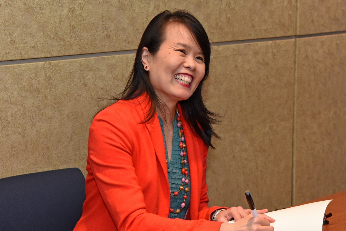 Amy Yee signing a book