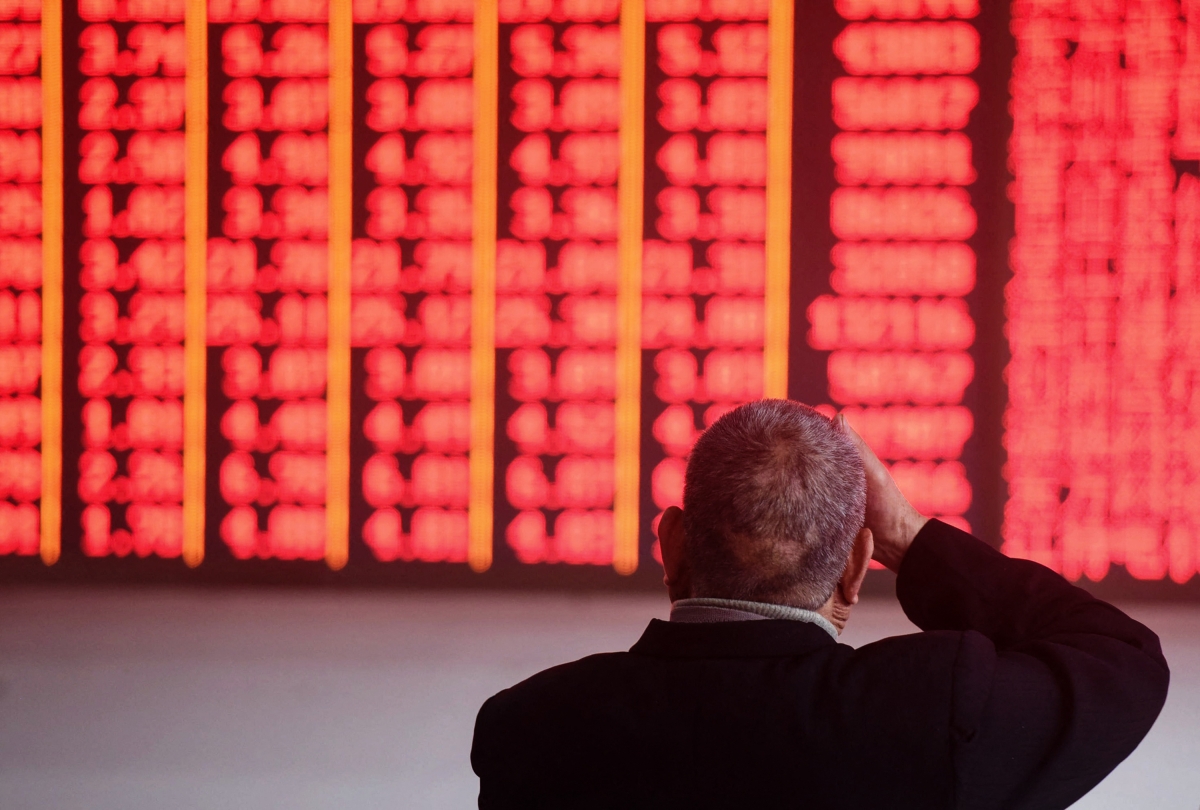 An investor monitors stock prices at a securities company at a securities company in Hangzhou in China