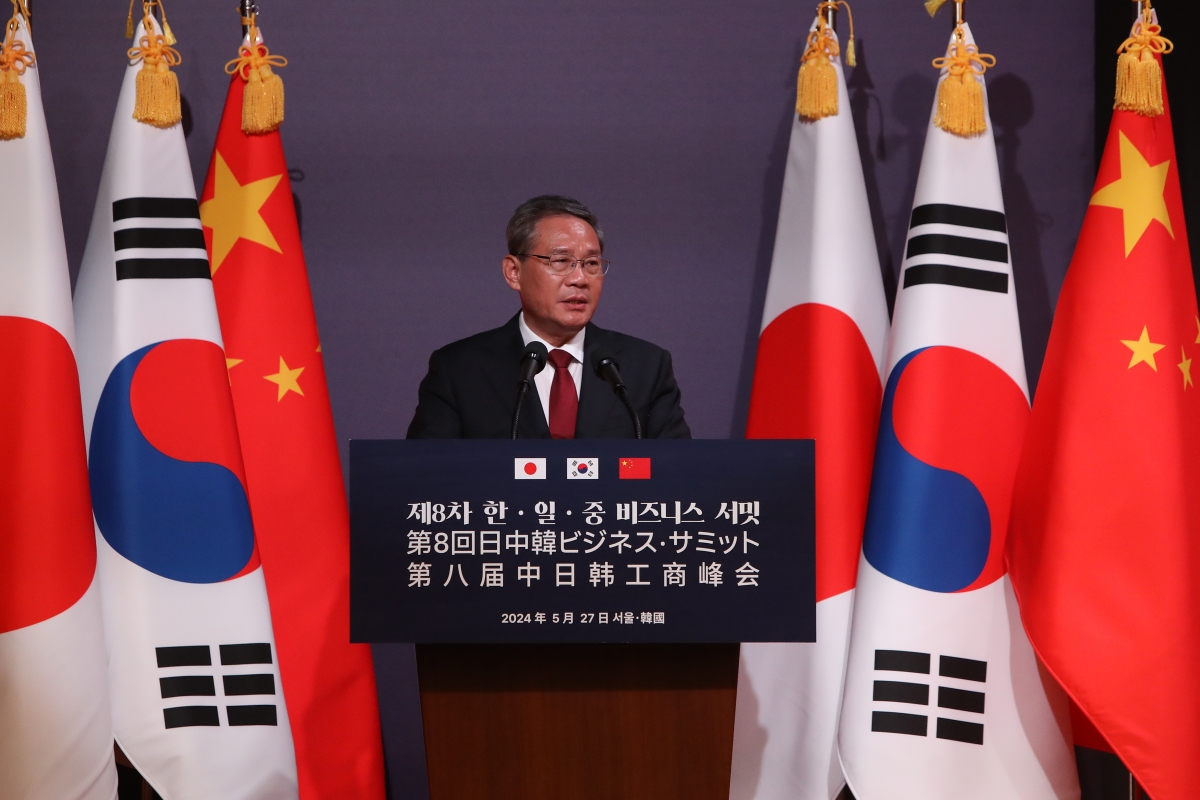 Chinese Premier Li Qiang speaks during a business summit on the sidelines of a trilateral summit at Korea Chamber of Commerce and Industry
