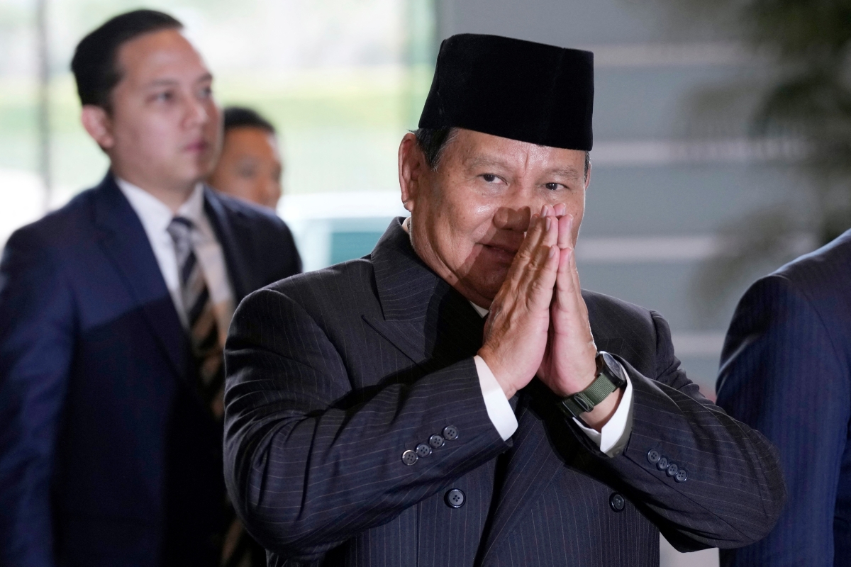Indonesian president-elect and current Defense Minister Prabowo Subianto greets journalists