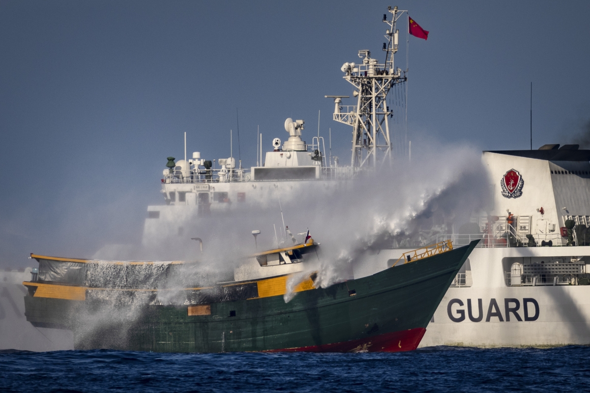 A Chinese Coast Guard ship fires a water cannon at Unaizah May 4, a Philippine Navy chartered vessel