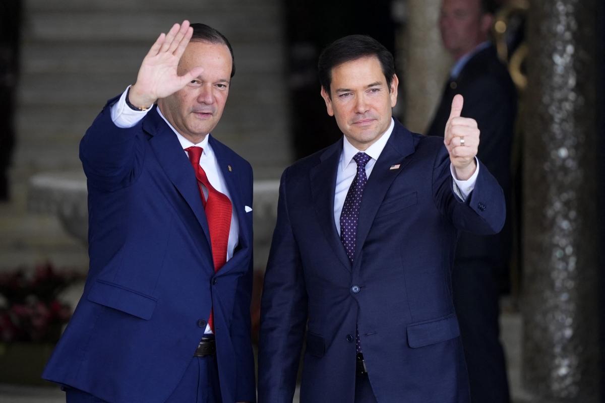 Panamanian Foreign Minister Javier Martinez-Acha and U.S. Secretary of State Marco Rubio wave at the presidential palace in Panama City on February 2, 2025.