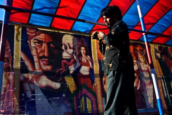 An entertainer sets up a tent for a magic show for the Pokhara Street Festival. (Sai Abishek)