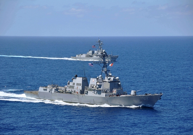 The guided-missile destroyers USS Sampson and USS Pinkney operate in the South China Sea in 2010. (U.S. Navy/David Mercil)