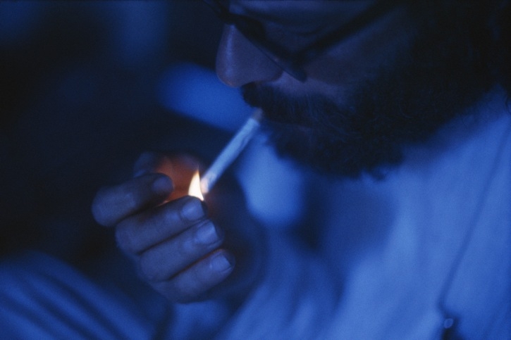 BENARES, INDIA - FEBRUARY 1963:  Ginsberg smoking in his apartment. (Pete Turner/Getty Images)