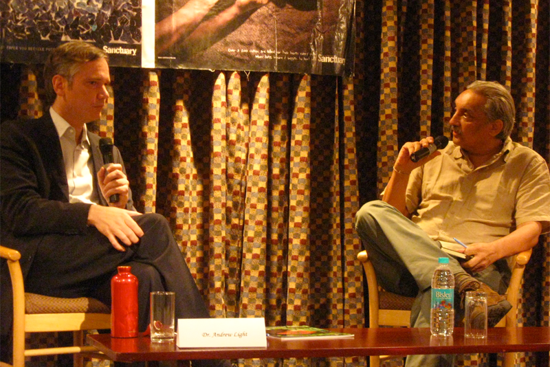 Dr. Andrew Light, left, discussed climate change policy with Bittu Sahgal.