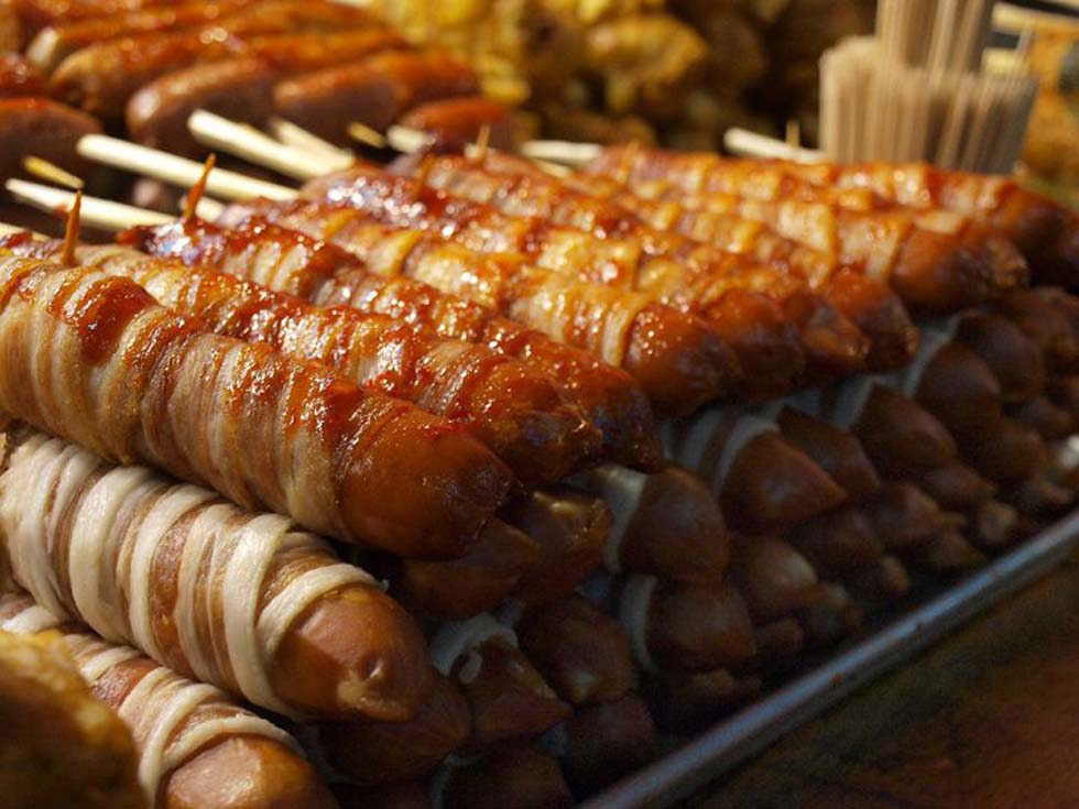 Bacon-wrapped sausages on a stick from Seoul, Korea. (Briana Green)