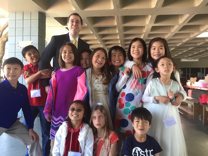  Chris, pictured above with students, in his current role as Chinese program director and elementary school principal at International School of the Peninsula in Palo Alto, CA.