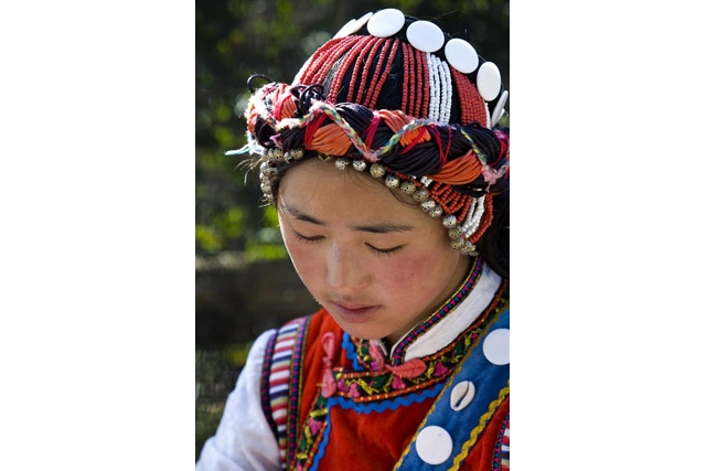 A girl in traditional clothing of a minority peoples in Kunming, China. (babasteve/flickr)