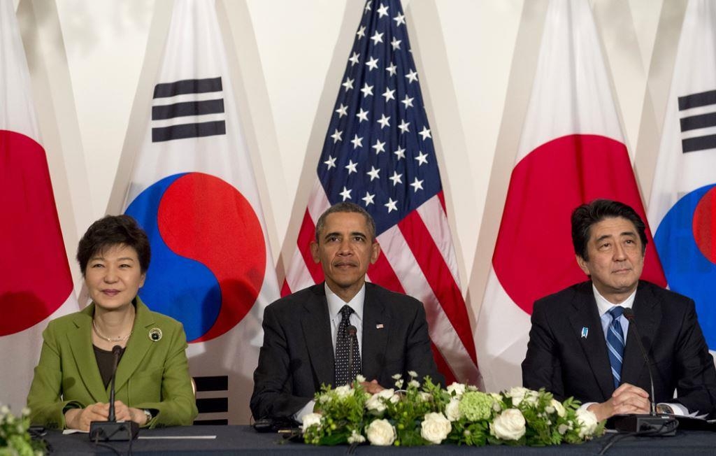 L to R: South Korean President Park Geun-hye, U.S. President Barack Obama, and Japanese Prime Minister Shinzo Abe at the U.S. ambassador's residence in The Hague on March 25, 2014. (Saul Loeb/AFP/Getty Images)