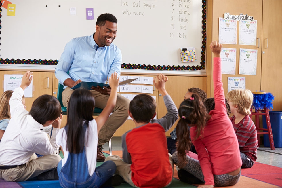 A teacher with his elementary class