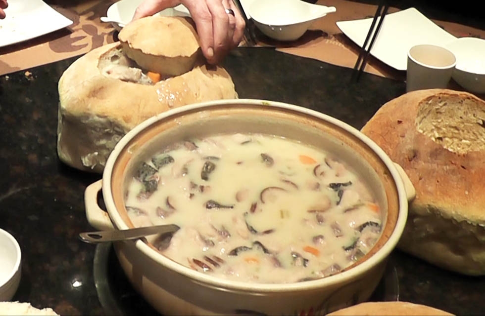 Chowder in a bread bowl from "Sauced in Translation" episode 2 in Harbin, Heilongjiang, China. (Howie Southworth)