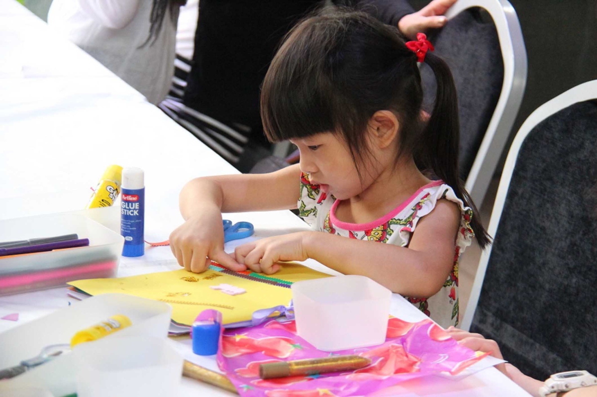 A young participant creating her Miffy Sketch Book