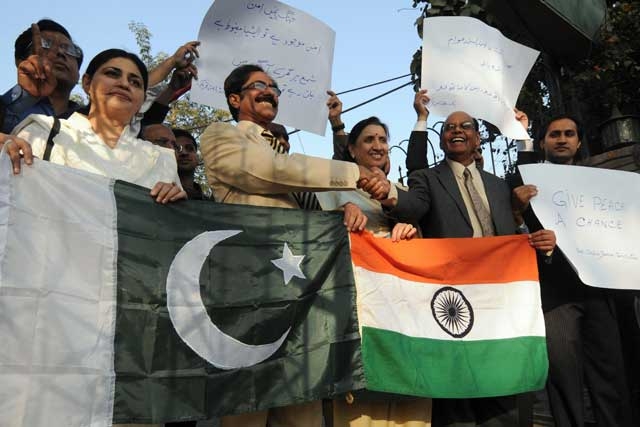 Activists from the Pakistan India Peoples Forum for Peace and Democracy hold their flags during a protest against the Mumbai attacks, in Lahore on December 4, 2008. (Arif Ali/AFP/Getty Images)