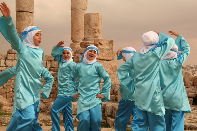 A group of girls dance to celebrate the birth of the prophet Mohammed in Citadeel, Amman, Jordan.  (hazy_jenius/flickr)