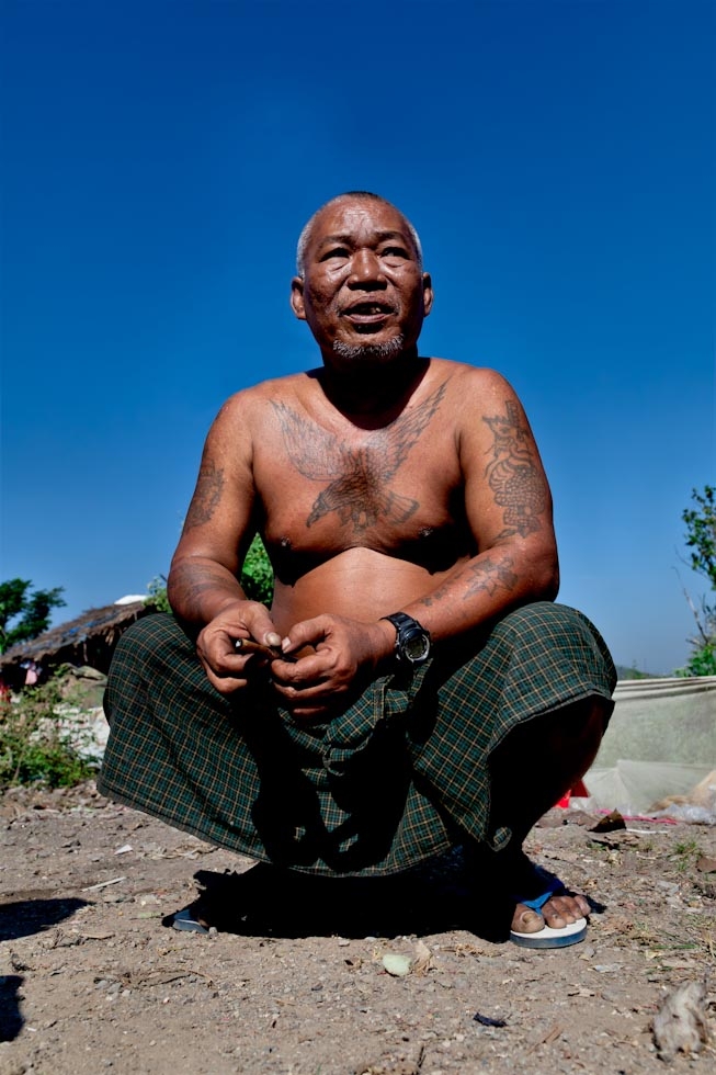 65-year-old Freddy, an ex-Rangoon boxer, has spent ten years at the dump awaiting relocation. He said, “My future is lost and my children’s future is lost. We are like dogs, except that we can cook for ourselves." (Jacques Maudy)