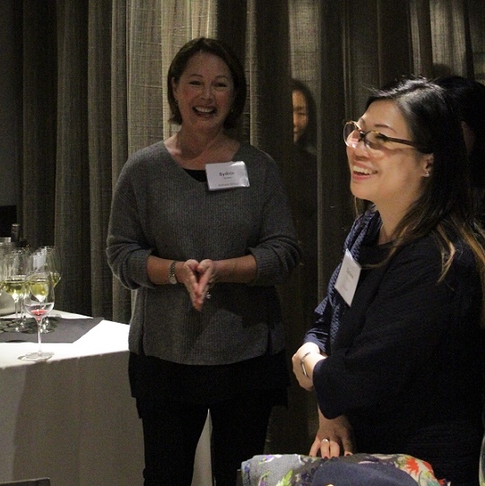 Sydnie Kohara, member of the ASNC Advisory Board and Darlene Chiu Bryant of ChinaSF laugh before dinner starts (Stesha Marcon)