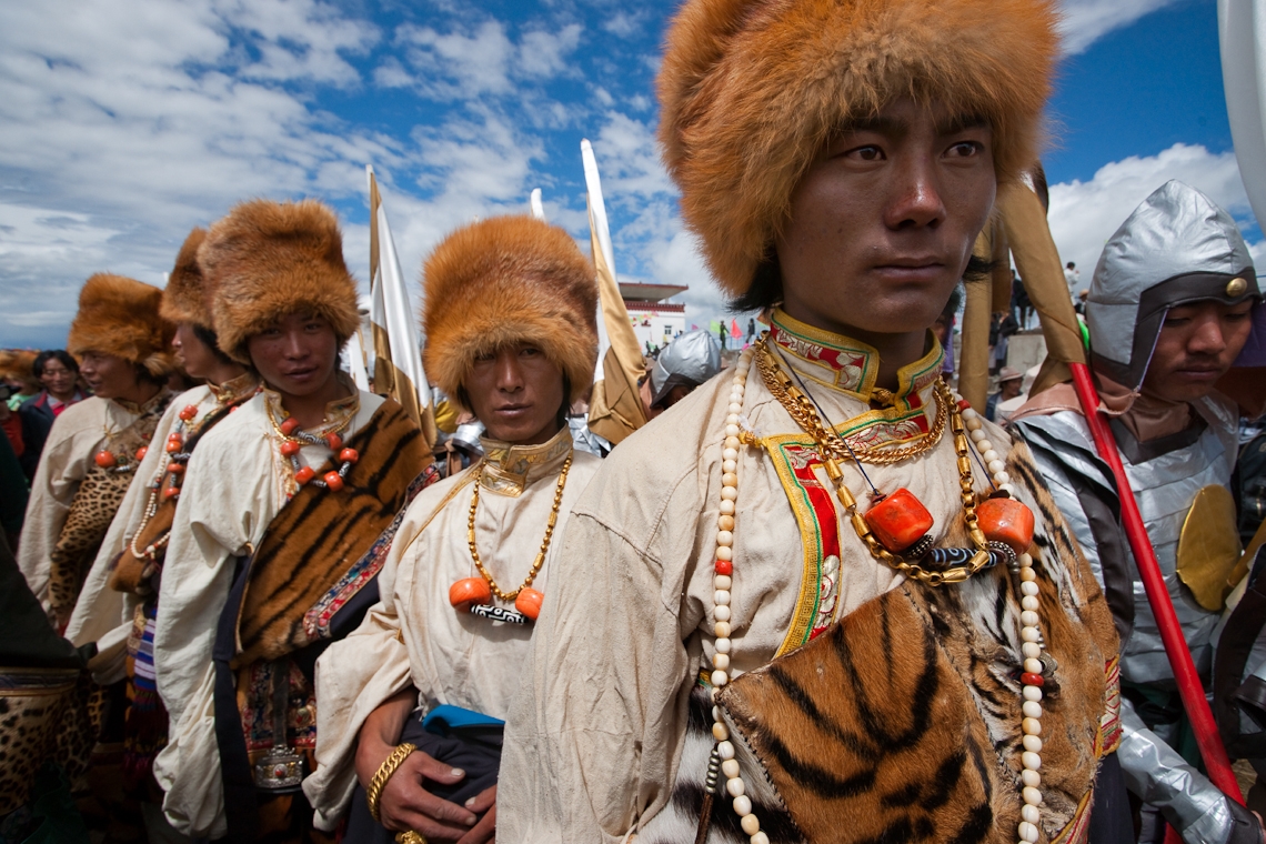 Not to be outdone by the ladies, these men wear heirloom costumes made with leopard and tiger skins and red fox fur hats. (Michael Yamashita)