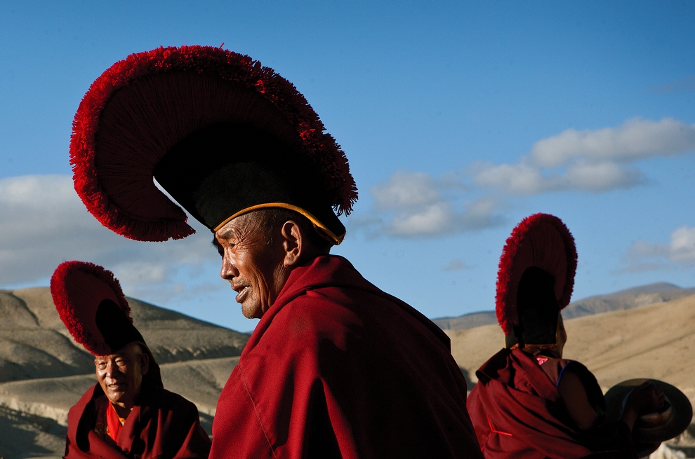 A group of senior monks gather for a ceremony on a field outside of Lo Manthang. (Taylor Weidman)
