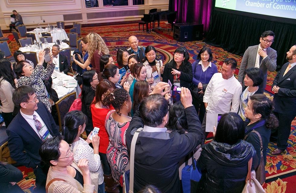 NCLC attendees gather around Martin Yan after his panel. (David Keith)