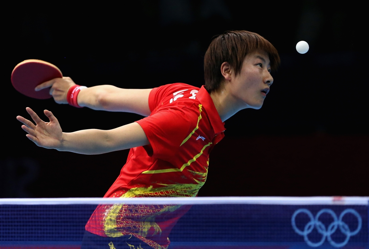 Ning Ding of China in action against Kyungah Kim of Korea during the women's team table tennis semifinals on August 6, 2012. (Ezra Shaw/Getty Images)