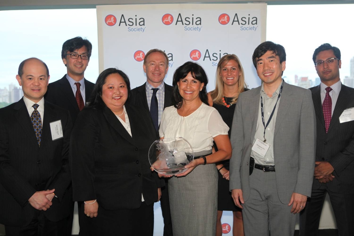 Kathy Hannan and KPMG LLP delegates with the Award for Overall Best Employer for Asian Pacific Americans