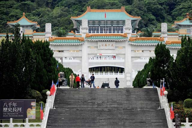 Tourists walk in front of the National Palace Museum in Taipei on January 6, 2009. The museum and its counterpart in Beijing plan to hold a joint exhibition of artifacts and arrange exchange of visits by their officials, in yet another sign of fast improving ties between Taiwan and rival China (SAM YEH/AFP/Getty Images).