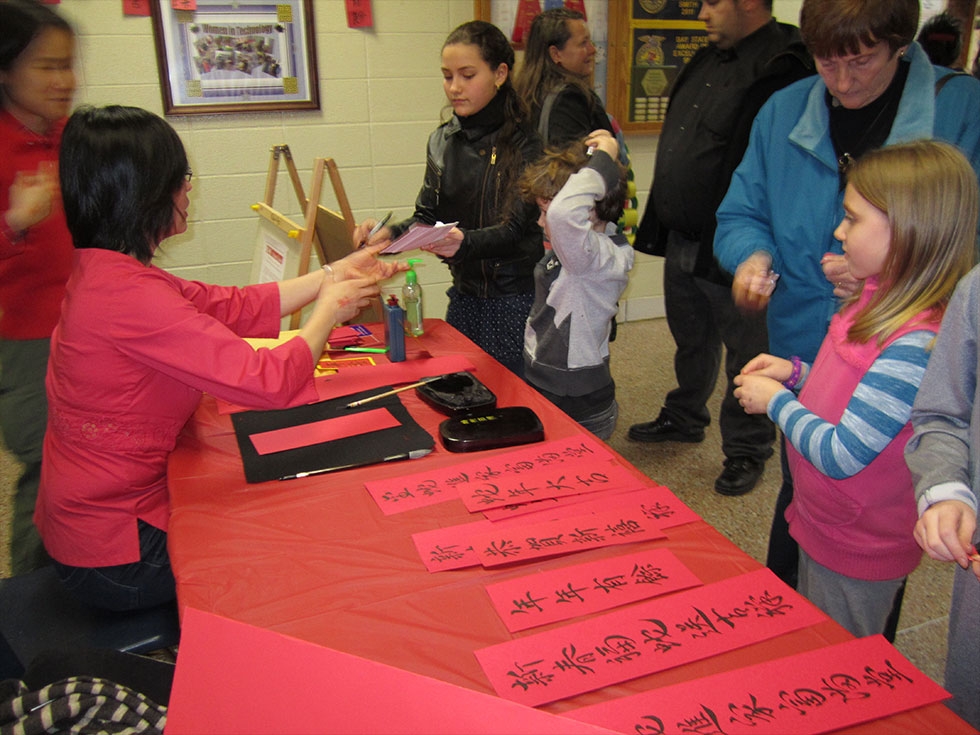 Art is taught in Chinese for elementary school students, and calligraphy is taught along with other art forms.