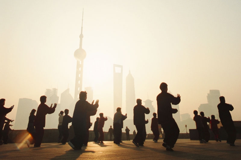 Residents practicing T'ai chi at dawn in Shanghai, China. (Kevin Phillips/Getty Images)