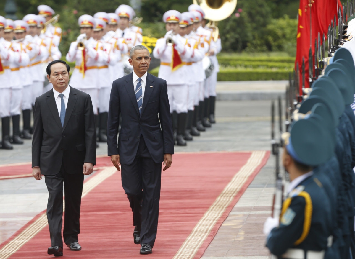 US President Barack Obama walks with his Vietnamese counterpart Tran Dai Quang as they review a guard of honour during a welcoming ceremony at the Presidential Palace in Hanoi on May 23, 2016. KHAM/AFP/Getty Images