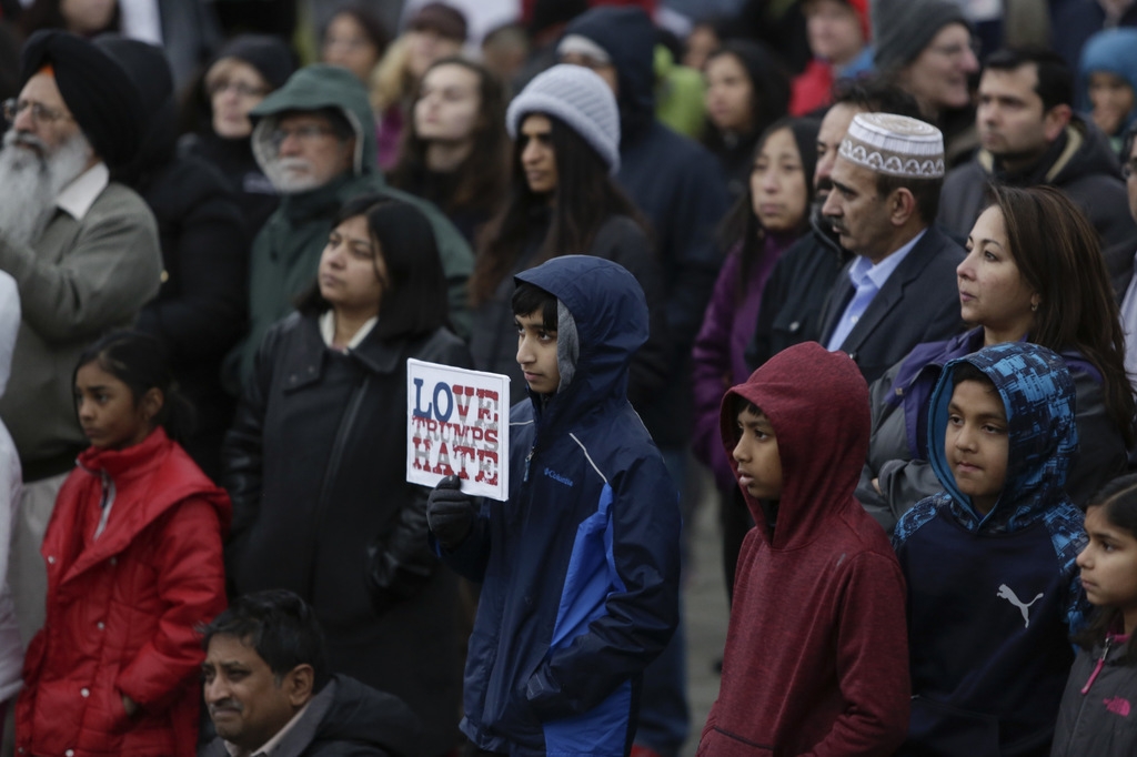 Members of the South Asian community and others attend a peace vigil for Srinivas Kuchibhotla, the 32-year-old Indian engineer killed at a bar Olathe, Kansas, in Bellevue, Washington on March 5, 2017. (Jason Redmond/AFP/Getty Images)