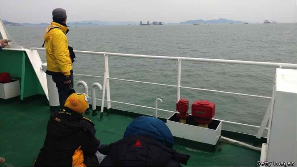 Family members looking on as the Sewol recovery process begins. (Source: Getty Images)
