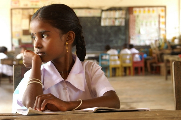 A girl studies in a classroom in Sri Lanka.