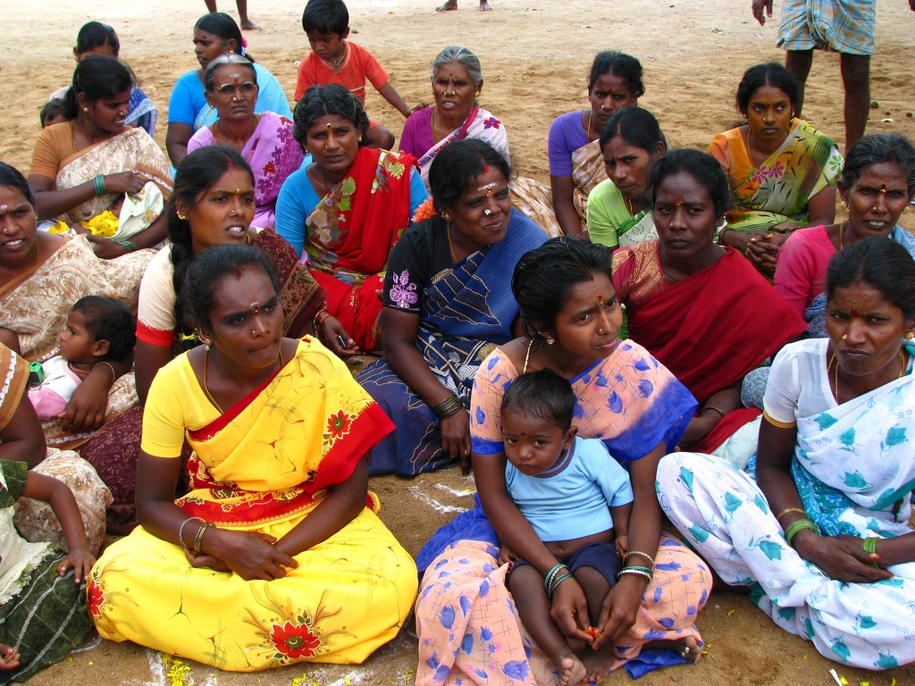 Rural women in their richly coloured saris meeting as members of self-help groups.  (mckaysavage/Flickr)