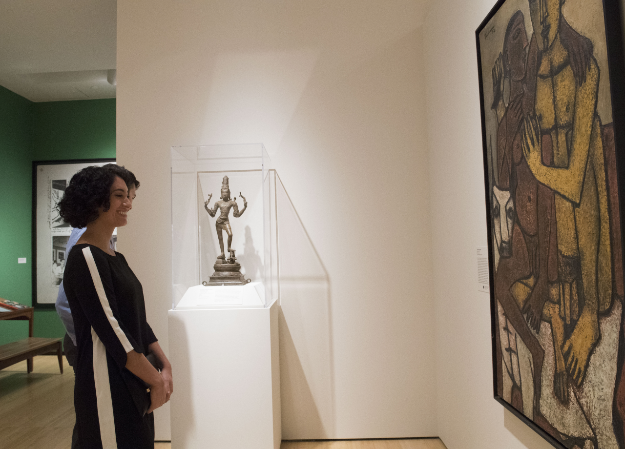Visitor looking at artwork at Asia Society Museum in New York