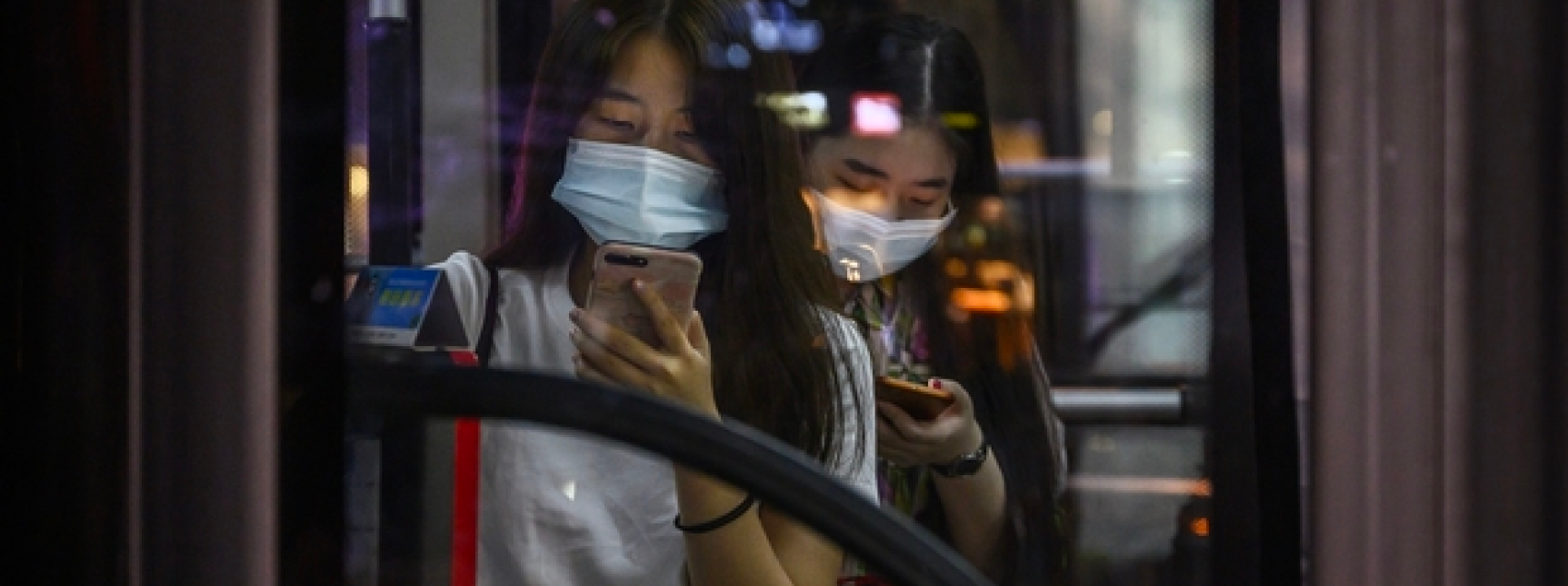 Women in mask on public transit