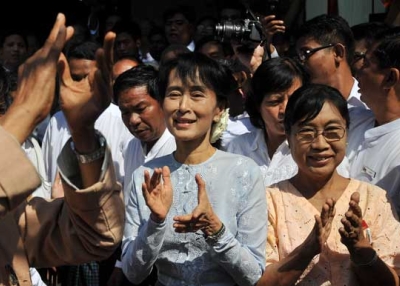 Myanmar democracy icon Aung San Suu Kyi (C) applauds during a ceremony at the National League for Democracy headquarters in Yangon on Jan. 9, 2012. (Soe Than Win/AFP/Getty Images)