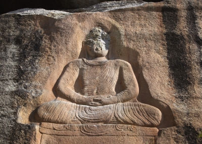 An ancient Buddha carved into into a mountainside sits defaced on Oct. 10, 2007 after Islamic extremists attacked the historic relic at Jehanabad in the Swat Valley of Pakistan. (John Moore/Getty Images)