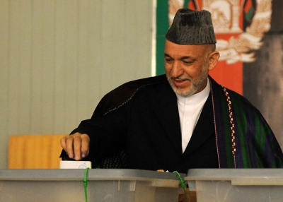 Afghan President Hamid Karzai casts his vote at a polling station in Kabul on August 20, 2009. (Shah Marai/AFP/Getty Images)
