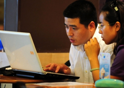 People use a laptop computer at a wireless cafe in Beijing on July 1, 2009, just after China delayed a plan requiring all new computers to come with a Chinese-made Internet filtering software program. (Frederic J. Brown/AFP/Getty Images)