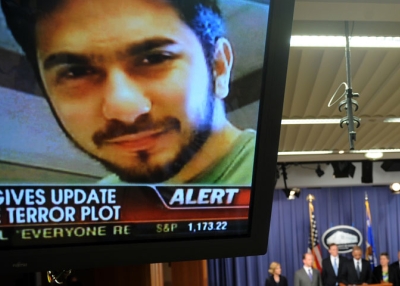 An image of terror suspect Faisal Shahzad is seen on a TV screen as federal and New York City officials hold a briefing on the Times Square attempted bombing, in Washington, DC, on May 4, 2010. (Jewel Samad/AFP/Getty Images)