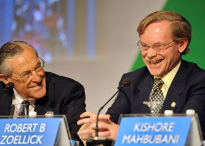 Richard Woolcott (L), former Australian secretary of foreign affairs and trade, shares a light moment with Robert Zoellick (R), president of the World Bank, during the APEC 20th anniversary high-level symposium on November 10, 2009 in Singapore. (Roslan Rahman/AFP/Getty Images)