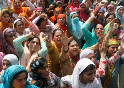 Kashmiri Muslim women shout slogans during the funeral procession of 19-year old Syed Farrukh Bukhari in Kreeri, north of Srinagar, on August 11, 2010. (Rouf Bhat/AFP/Getty Images)