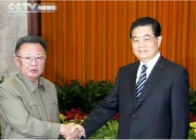 A TV grab from CCTV taken on May 7, 2010 shows Chinese President Hu Jintao (R) shaking hands with North Korean leader Kim Jong-Il in Beijing on May 7. (STR/AFP/Getty Images)