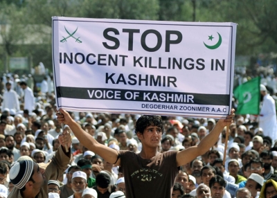 A Kashmiri protester holds a banner during an anti-India rally in Srinagar on September 11, 2010. The Muslim-majority Kashmir valley has been rocked by unrest since a teenage student was killed by a police tear-gas shell on June 11. (Sajjad Hussain/AFP/Getty Images) 