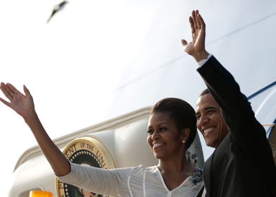 US President Barack Obama (R) and First Lady Michelle Obama wave after boarding Air Force One as they depart New Delhi on November 9, 2010. (Jim Watson/AFP/Getty Images)
