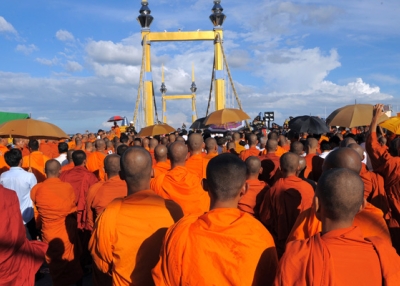 Cambodian Buddhist monks gather to pray for victims of the stampede in front of the bridge in Phnom Penh on November 23, 2010.